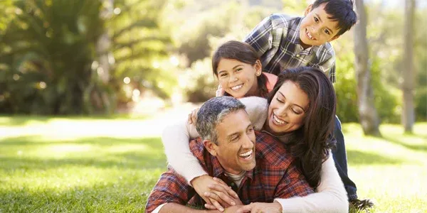 family outside mosquito free lawn